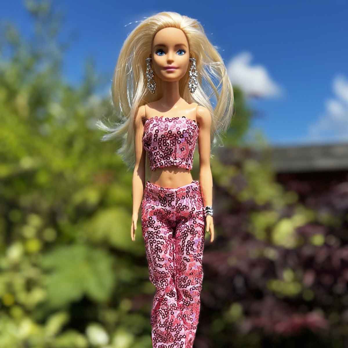 Barbie outfit fuchsia met strapless top en broek met pailletjes