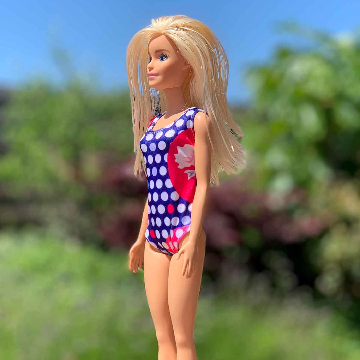 Barbie badpak blauw met witte rondjes en rode zijkant